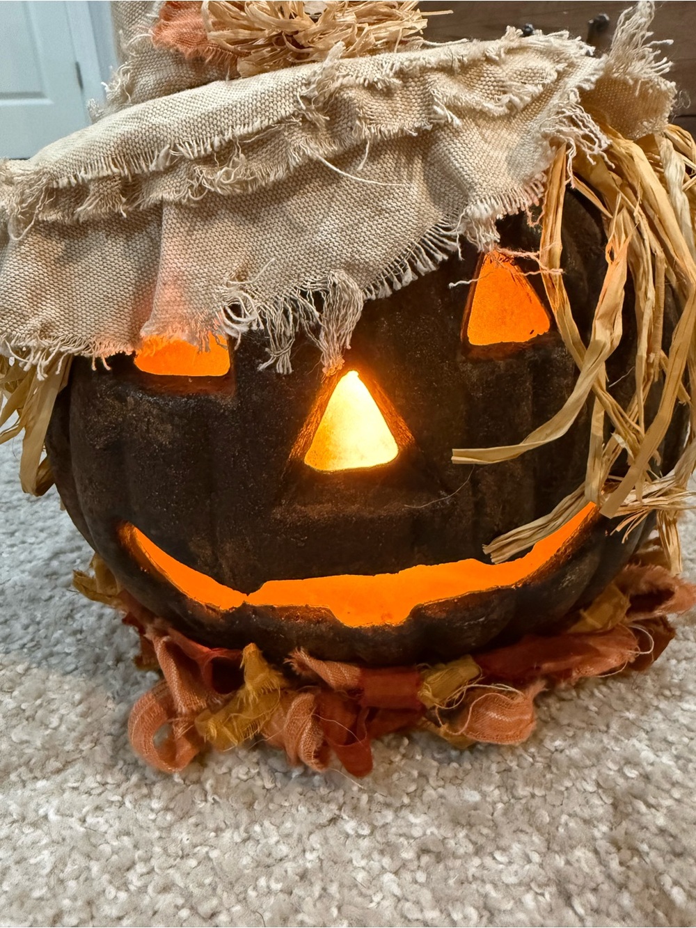 Handmade scarecrow jack o lantern flickering